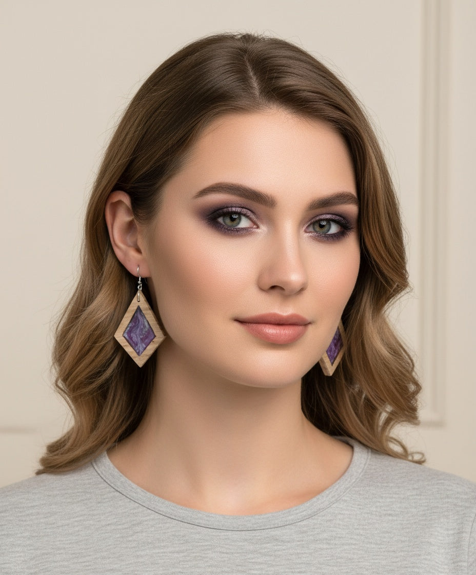 Woman wearing Mystic Purple earrings with a neutral background