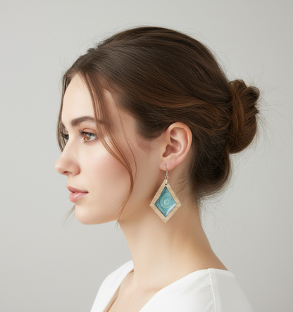 Woman wearing Turquoise earrings with a neutral background