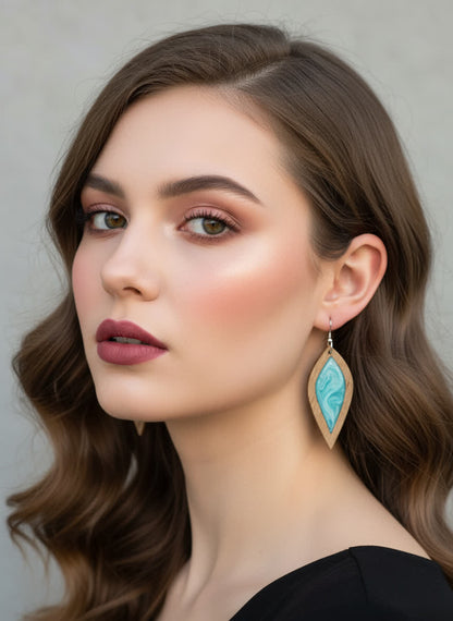 Woman wearing Turquoise Petal earrings with a neutral background